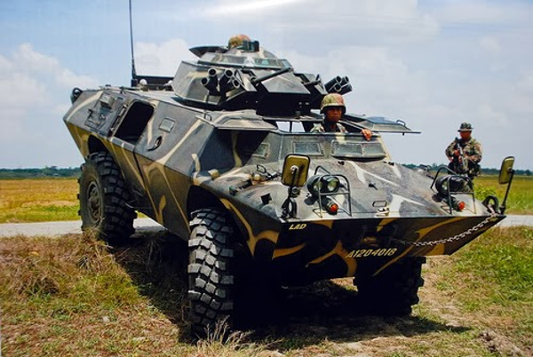 A Philippine Army V-150 Commando armored vehicle with a 1-man turret for 12.7mm and 7.62mm machine guns. Most wheeled armored vehicles with the Philippine ...