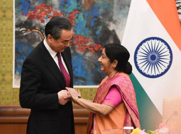 Foreign Minister Sushma Swaraj (right) shakes hands with her Chinese counterpart Wang Yi at the Diaoyutai State Guest:Photo Credit: REUTERS