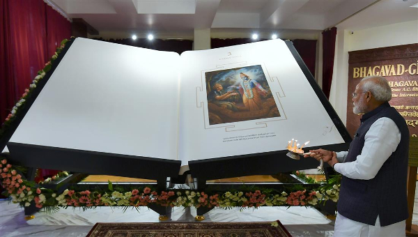 Prime Minister Narendra Modi unveiled a giant Bhagavad Gita, running into 670 pages and weighing 800 kg, at the ISKCON temple in New Delhi on Tuesday.
