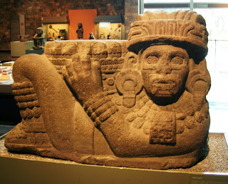 Elaborately decorated Chac Mool statue, holding a pillar like object emerging from his stomach. National Museum of Anthropology in Mexico City. Credit: Bibhu Dev Misra