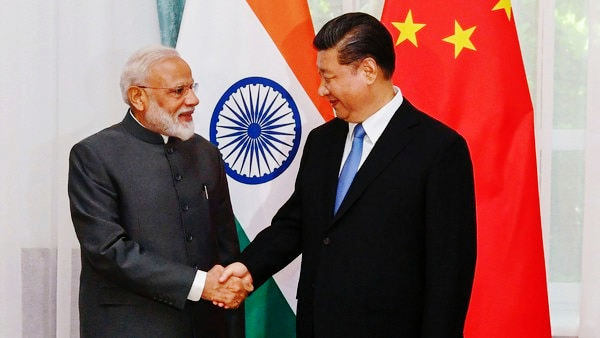 Modi Xi Shaking hands -India must exploit China’s worries about Pakistan