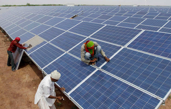 India bets on barren land, rail tracks to raise solar capacity