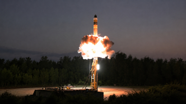 Missile launch at dusk with fiery plume